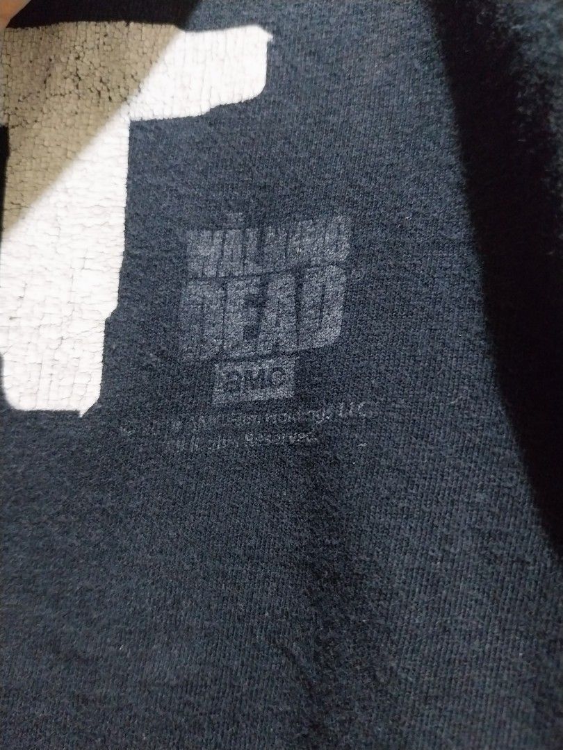 The Walking Dead "KILL IT" T-Shirt AMC (Category: Tshirts & Polo Shirts ) located in Taguig. Submitted by lumangdamit (Listing ID 1460063296, Image 2). Description: - Black t-shirt featuring Daryl Dixon from The Walking Dead. - "KILL IT" graphic on the front. - Officially made by AMC. - Perfect for fans of the show. - Shows some signs of wear (please check photos for condition). - Still has plenty of life left. - 23x28 Dimes - Multiple pinholes.