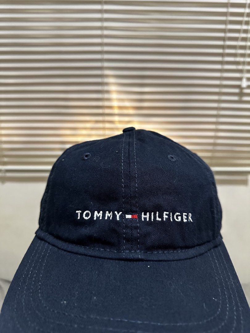 Tommy Hilfiger Cap (Category: Caps & Hats) located in Bacoor. Submitted by realbacktrack (Listing ID 1459912341, Image 3). Description: - Classic navy blue Tommy Hilfiger cap - Iconic embroidered logo on the front - Adjustable strap with metal buckle for a secure fit - Versatile accessory for everyday wear - Ideal for sunny days or completing any outfit *needswash.