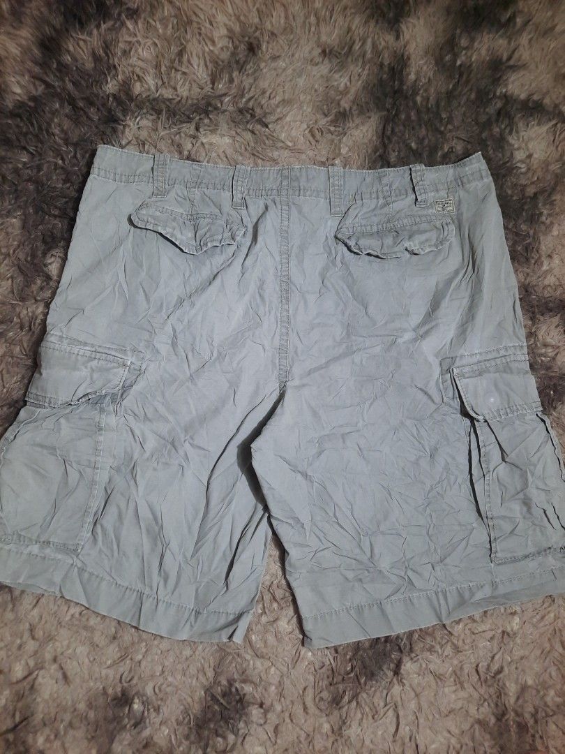 Tommy Hilfiger Cargo Shorts Grey Size 38 (Category: Shorts) located in Lapu Lapu. Submitted by markbel26 (Listing ID 1460095906, Image 3). Description: - Grey Tommy Hilfiger cargo shorts - Size 38 - Multiple pockets for ample storage - Secure button and zip closure - Ideal for casual outings.