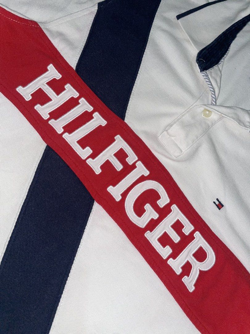 Tommy Hilfiger Polo Shirt (Category: Tshirts & Polo Shirts ) located in Las Pinas. Submitted by rdcthriftedshop (Listing ID 1460042139, Image 2). Description: 📦 Tommy Hilfiger (Authentic) Spell out embroider Medium on tag Width: 18.5 Length: 27 EXCELLENT CONDITION Color rate: 9/10 Issue: Super Light Bloody stain.