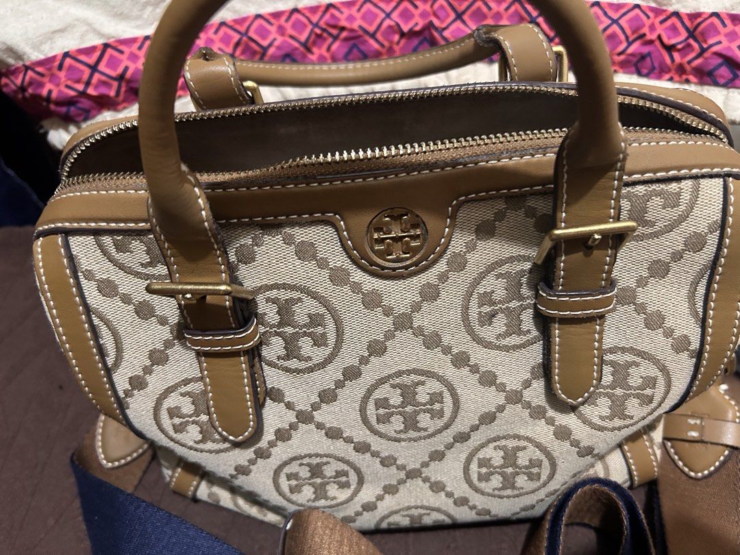 Tory burch bag and wallet (Category: Luxury Bags & Wallets) located in Manila. Submitted by just4_kikays (Listing ID 1459905160, Image 2). Description: Brand: Tory Burch * Style: Robinson Double Zip Tote / similar Robinson logo-jacquard version * Color: Beige/cream with tan/caramel leather trim * Material: Logo jacquard fabric/canvas with leather trim * Hardware: Gold-tone/brass * Closure: Top zipper * Handles: Two leather top handles * Shoulder 