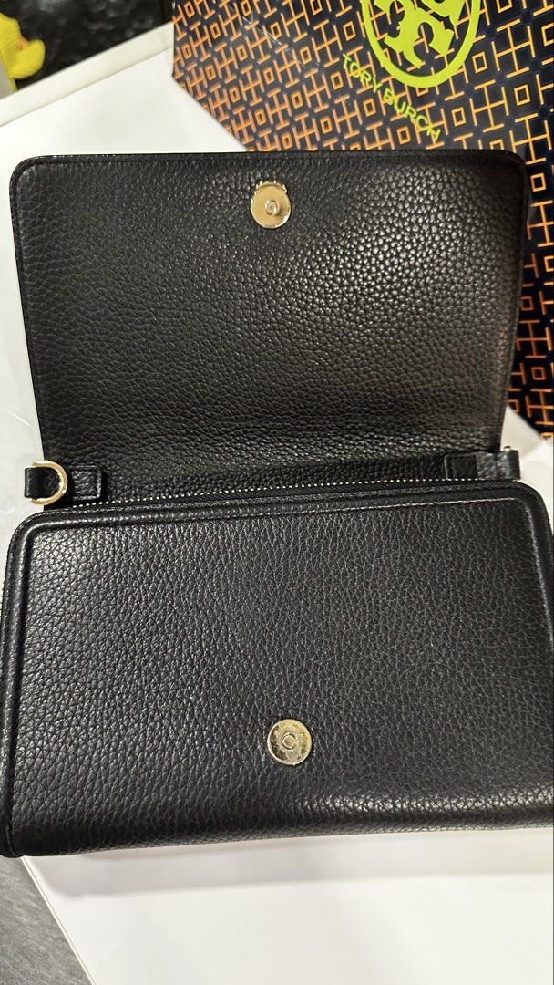 Tory Burch Black Leather Wallet with Chain and Strap (Category: Luxury Bags & Wallets) located in Rizal. Submitted by dumbchowdy (Listing ID 1460037719, Image 3). Description: - Genuine Tory Burch black pebbled leather wallet - Multiple interior card slots - Zippered compartments for secure storage - Detachable gold chain for clutch style - Adjustable black leather crossbody strap for hands-free wear - Includes original Tory Burch shopping bag - 