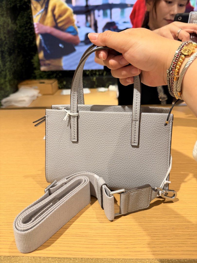 Tory Burch Blake Mini Tote Bag (Category: Tote Bags) located in Quezon City. Submitted by pernella (Listing ID 1460103368, Image 2). Description: Tory Burch Brand New Color: Bay Gray Original price: P39,740 On-Hand Fits iphone promax.