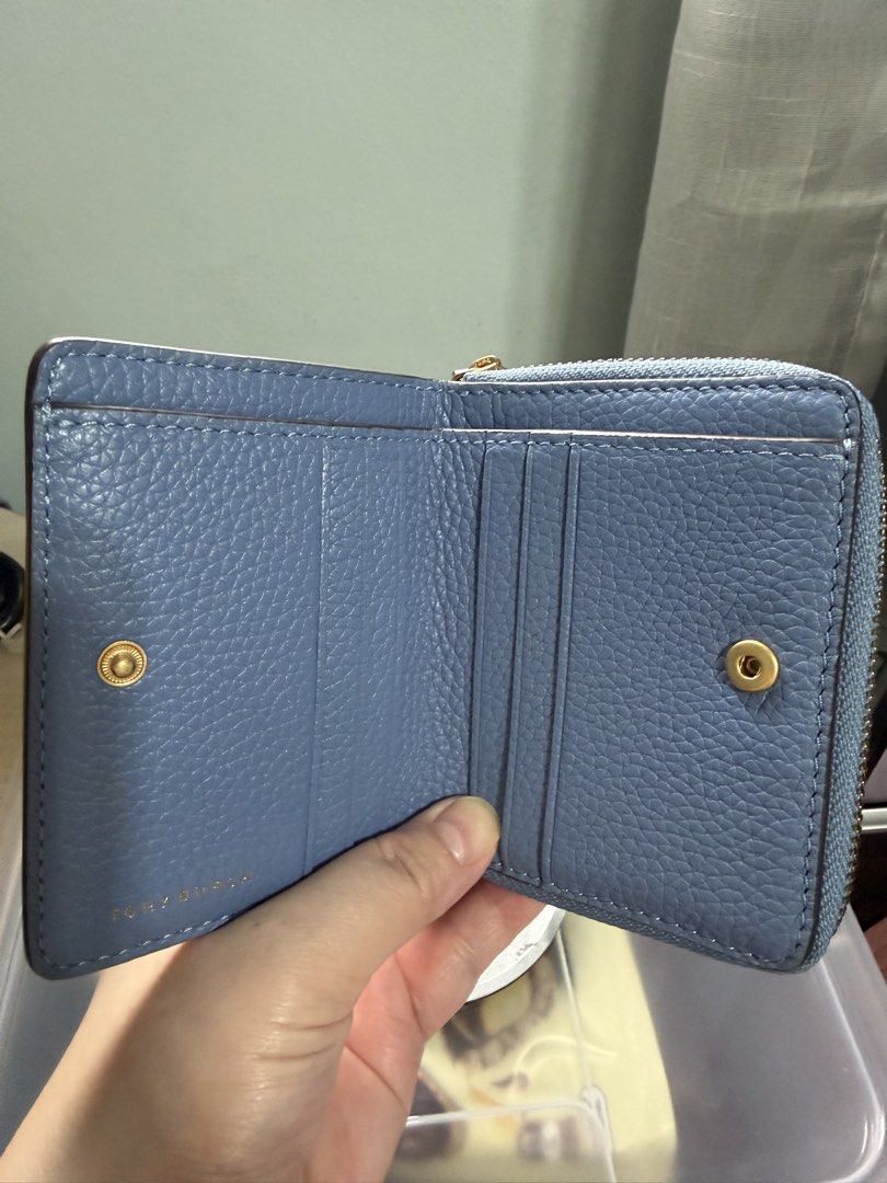 Tory Burch Blue Leather Bi-Fold Zip Around Wallet (Category: Wallets & Card holders) located in Quezon City. Submitted by ja_preloved4u (Listing ID 1459993346, Image 3). Description: - Authentic - Blue pebbled leather Tory Burch wallet - Zip around closure coin pocket - Interior card slots and snap closure - Gold tone hardware - Iconic Tory Burch logo on front - Compact size, ideal for everyday use and small bags.