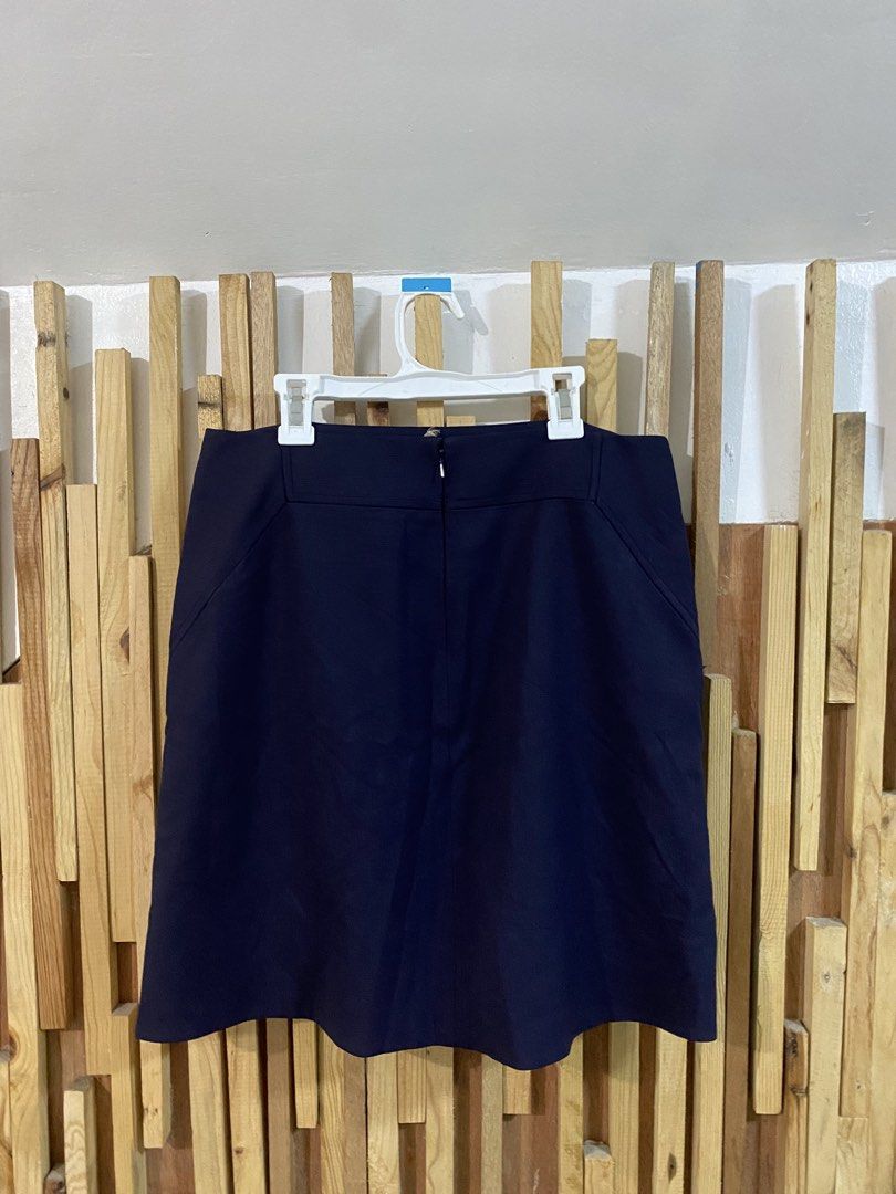 Tory Burch Navy Blue A-Line Skirt (Category: Skirts) located in Angeles City. Submitted by calmrabbit.ae2127 (Listing ID 1459978547, Image 3). Description: - Navy blue A-line skirt - Brand: Tory Burch - Length: Knee-length - Closure: Back zip - Features: Front pockets - Style: Simple, classic - Versatile: Suitable for work or casual wear.