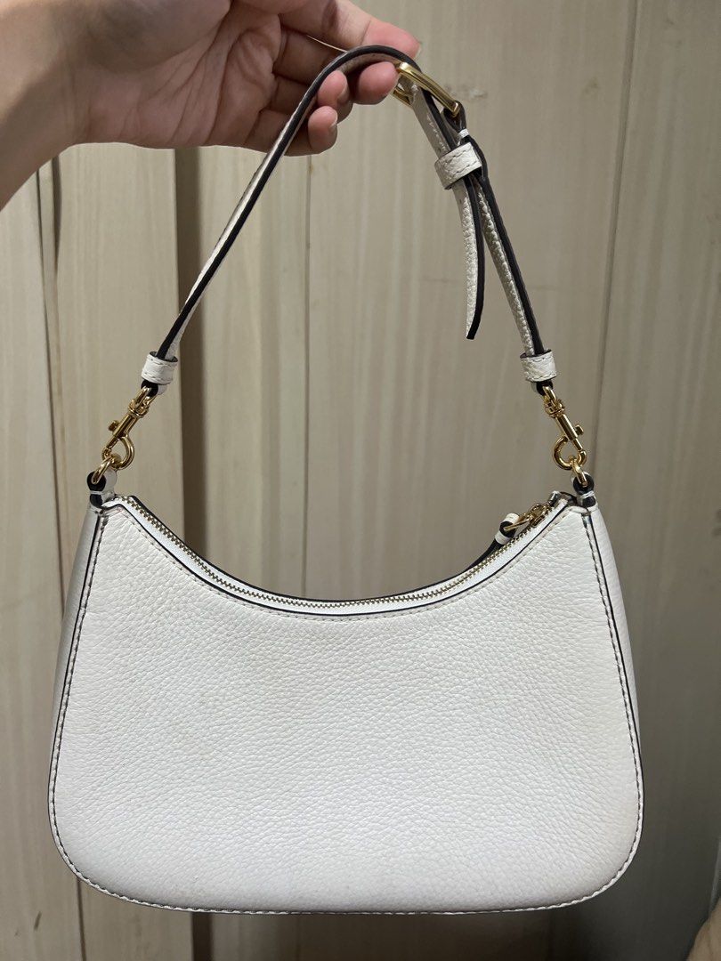 Tory Burch White Leather Shoulder Bag (Category: Luxury Bags & Wallets) located in Quezon City. Submitted by luckysellsxoxo (Listing ID 1459942399, Image 2). Description: - White shoulder bag - Comes with strap - Bought for ~$198 from Outlet store in USA last 2024 - Only worn out <5x - minor issues: it got molds from storage :( .