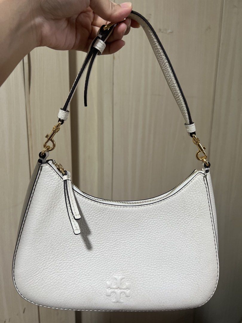 Tory Burch White Leather Shoulder Bag (Category: Luxury Bags & Wallets) located in Quezon City. Submitted by luckysellsxoxo (Listing ID 1459942399, Image 1). Description: - White shoulder bag - Comes with strap - Bought for ~$198 from Outlet store in USA last 2024 - Only worn out <5x - minor issues: it got molds from storage :( .