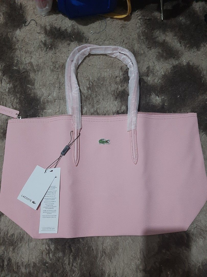 Tote Bags (Category: Tote Bags) located in Davao. Submitted by nisa_chan04 (Listing ID 1460067019, Image 2). Description: - Brand new pink tote bag - Features the signature logo - Handles still wrapped in plastic - Comes with original tags attached - Ideal size for everyday essentials - Spacious interior for ample storage SOLD PER PEICE not bundle..