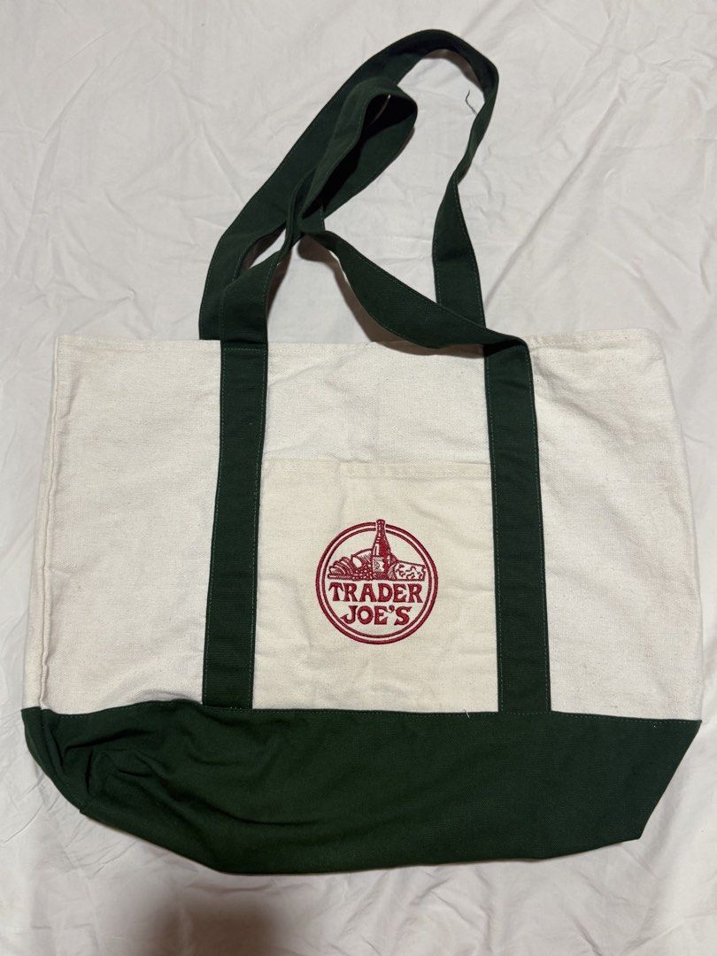 Trader Joe's Canvas Tote Bag (Category: Tote Bags) located in Muntinlupa City. Submitted by prelovedbymargs (Listing ID 1460098181, Image 2). Description: - Trader Joe’s Large Reusable Canvas Tote Bag (Dark Green) - Brand new with tag (not seen in photo) - Bought in NYC 🇺🇸, from my personal stash - RFS: Decluttering, have all the colors already - My mom just enjoys buying them there - P750 - Strictly gcash or bank transfer only - Buyer will sho