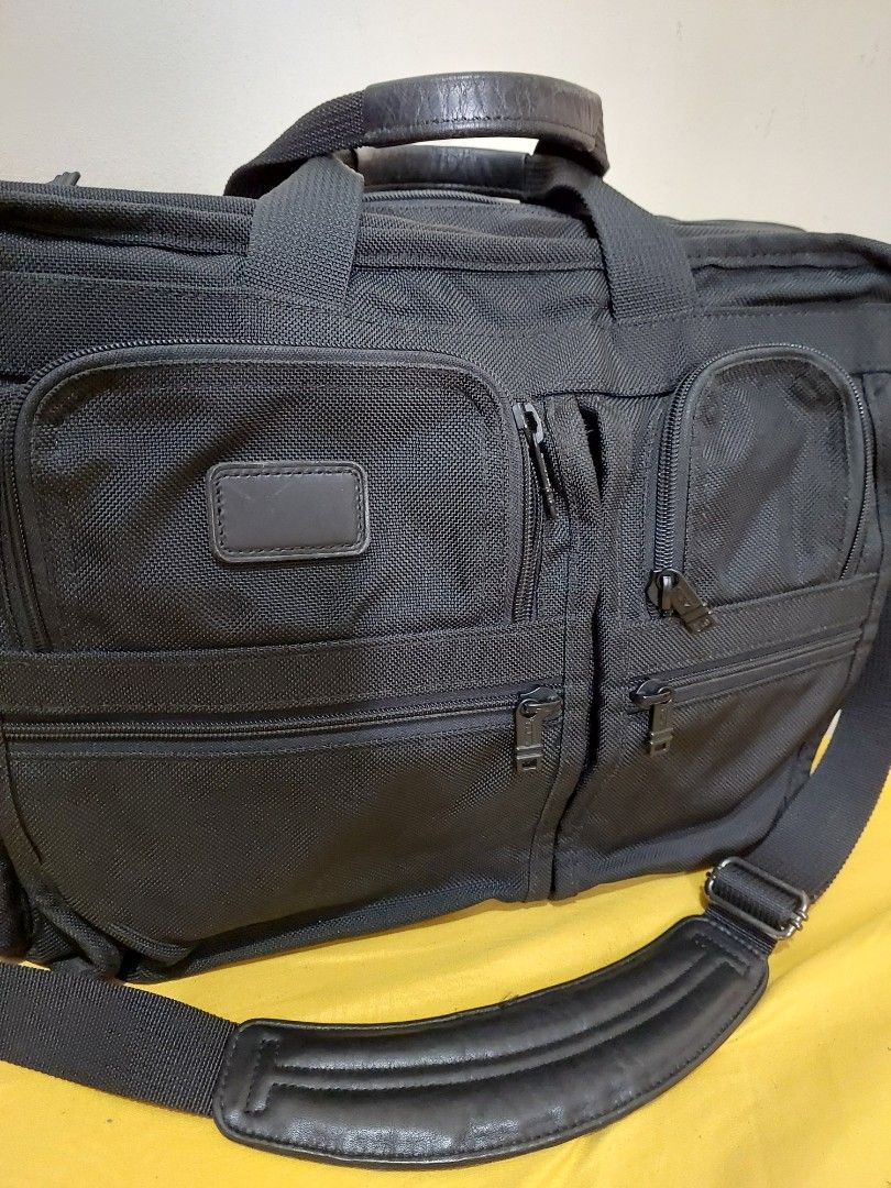 Tumi Alpha expandable black ballistic nylon briefcase work shoulder bag (Category: Briefcases) located in Malabon City. Submitted by jullie_bag_shop (Listing ID 1459993106, Image 1). Description: - Brand: Tumi - Color: Black - Material: Durable Ballistic Nylon - Features: Multiple interior compartments for organization, padded shoulder strap, leather handles - Ideal for: Work or travel - Capacity: Plenty of space for laptop and essentials.