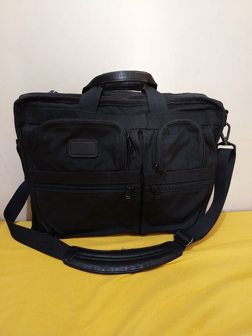 Tumi Alpha expandable black ballistic nylon briefcase work shoulder bag (Category: Briefcases) located in Malabon City. Submitted by jullie_bag_shop (Listing ID 1459993106, Image 2). Description: - Brand: Tumi - Color: Black - Material: Durable Ballistic Nylon - Features: Multiple interior compartments for organization, padded shoulder strap, leather handles - Ideal for: Work or travel - Capacity: Plenty of space for laptop and essentials.