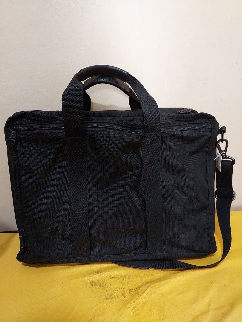 Tumi Alpha expandable black ballistic nylon briefcase work shoulder bag (Category: Briefcases) located in Malabon City. Submitted by jullie_bag_shop (Listing ID 1459993106, Image 3). Description: - Brand: Tumi - Color: Black - Material: Durable Ballistic Nylon - Features: Multiple interior compartments for organization, padded shoulder strap, leather handles - Ideal for: Work or travel - Capacity: Plenty of space for laptop and essentials.