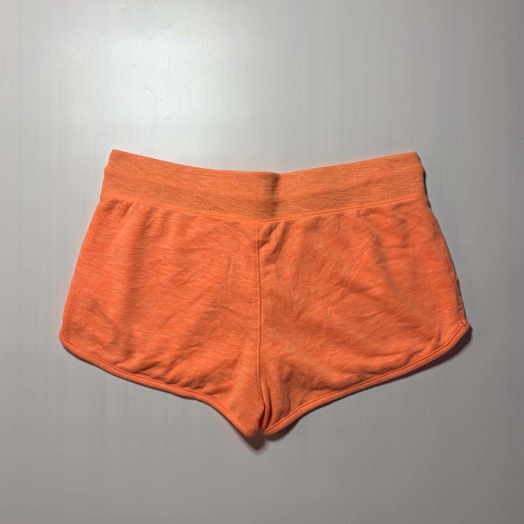 Under Armour Orange Athletic Shorts S-M (Category: Shorts) located in Baguio. Submitted by cosmogyralfinds (Listing ID 1460057397, Image 3). Description: - Orange Under Armour shorts - Size: S-M - Waist: 30-34 inches - Length: 10 inches - Hem: 13 inches - Ideal for workouts and lounging - Features a comfortable drawstring waist - Made with soft, breathable material - Perfect for an active lifestyle.