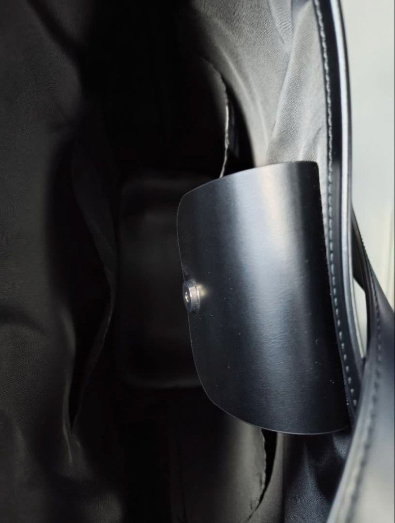 Uniqlo Black Bucket Bag (Category: Shoulder Bags) located in Manila. Submitted by lovemythrifts (Listing ID 1460037604, Image 3). Description: - Classic black leather bucket bag - Simple and chic design - Adjustable shoulder strap - Interior pocket for small items - Spacious for everyday essentials.
