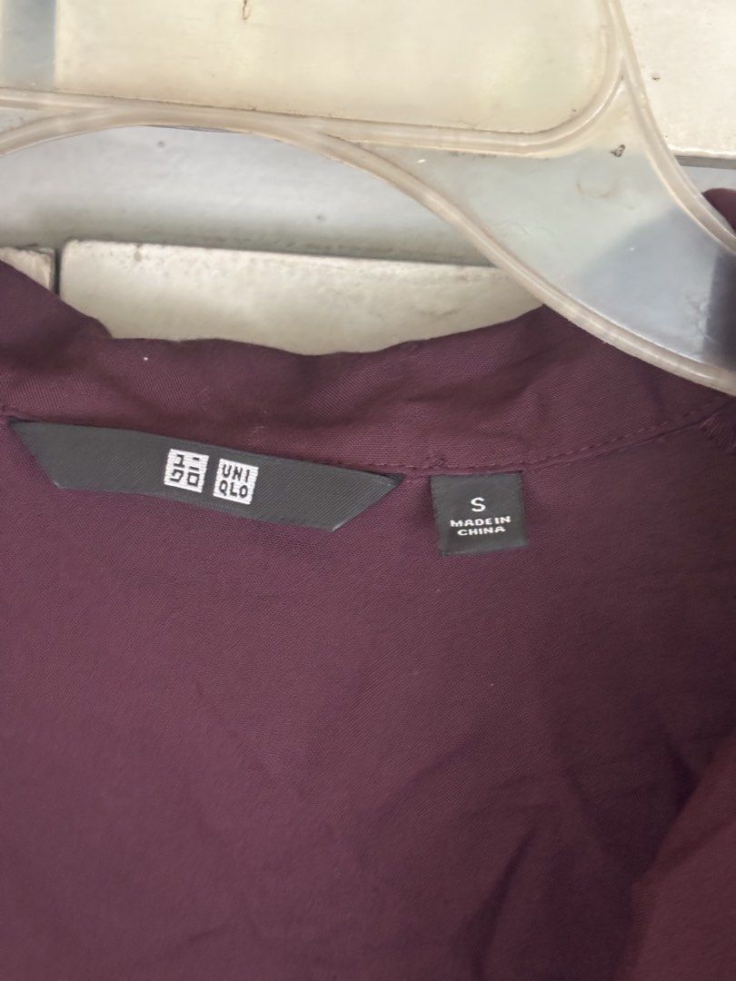 Uniqlo Long Sleeve Button Up Shirt (Category: Blouses) located in Cainta. Submitted by doverparfum (Listing ID 1459943088, Image 2). Description: - Uniqlo long sleeve shirt - Button-up front - Deep plum color - Relaxed fit - Great for layering or wearing on its own - Size: Small.