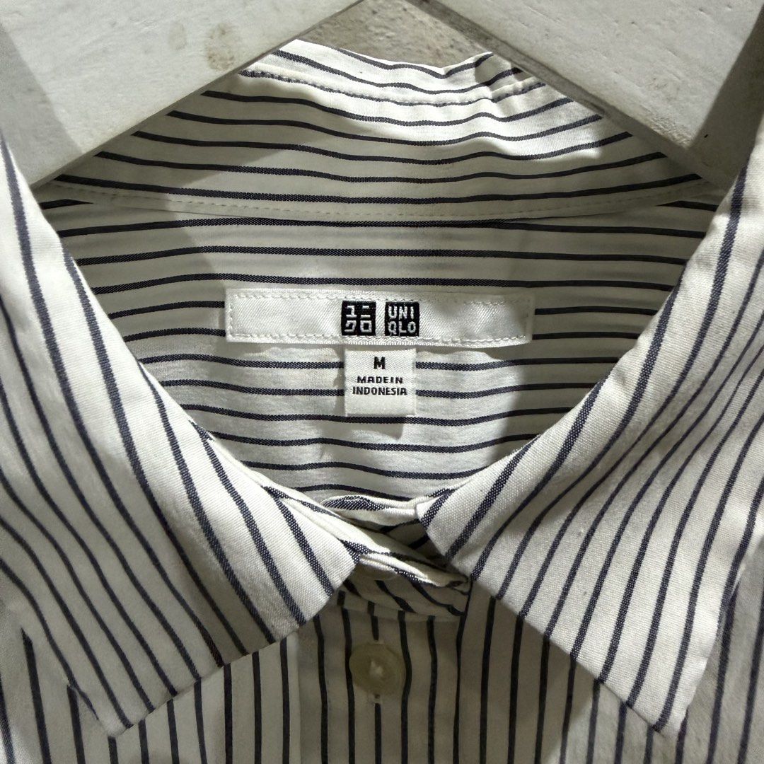 Uniqlo Striped Button-Up Shirt Size M (Category: Shirts) located in Minalabac. Submitted by ashleysusedclothingshop (Listing ID 1459937065, Image 2). Description: Uniqlo Long-Sleeved Shirt Classic Navy & White Pinstripe Pattern Button-up Front with Collar With washable stains.