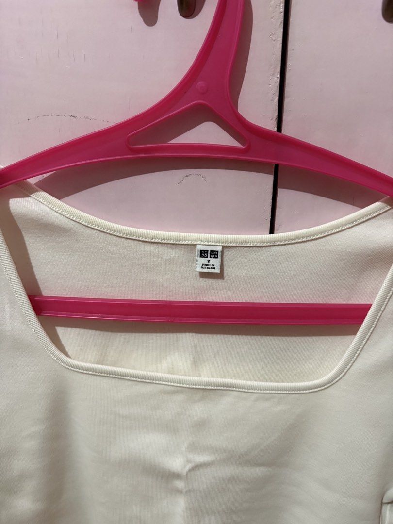 Uniqlo White Square Neck Cropped Top (Category: Shirts) located in Taguig. Submitted by xoalexv (Listing ID 1459992324, Image 2). Description: - White cropped top from Uniqlo - Features short sleeves and a square neckline - Simple and versatile design - Perfect for layering or wearing on its own - Easy to style with various bottoms.