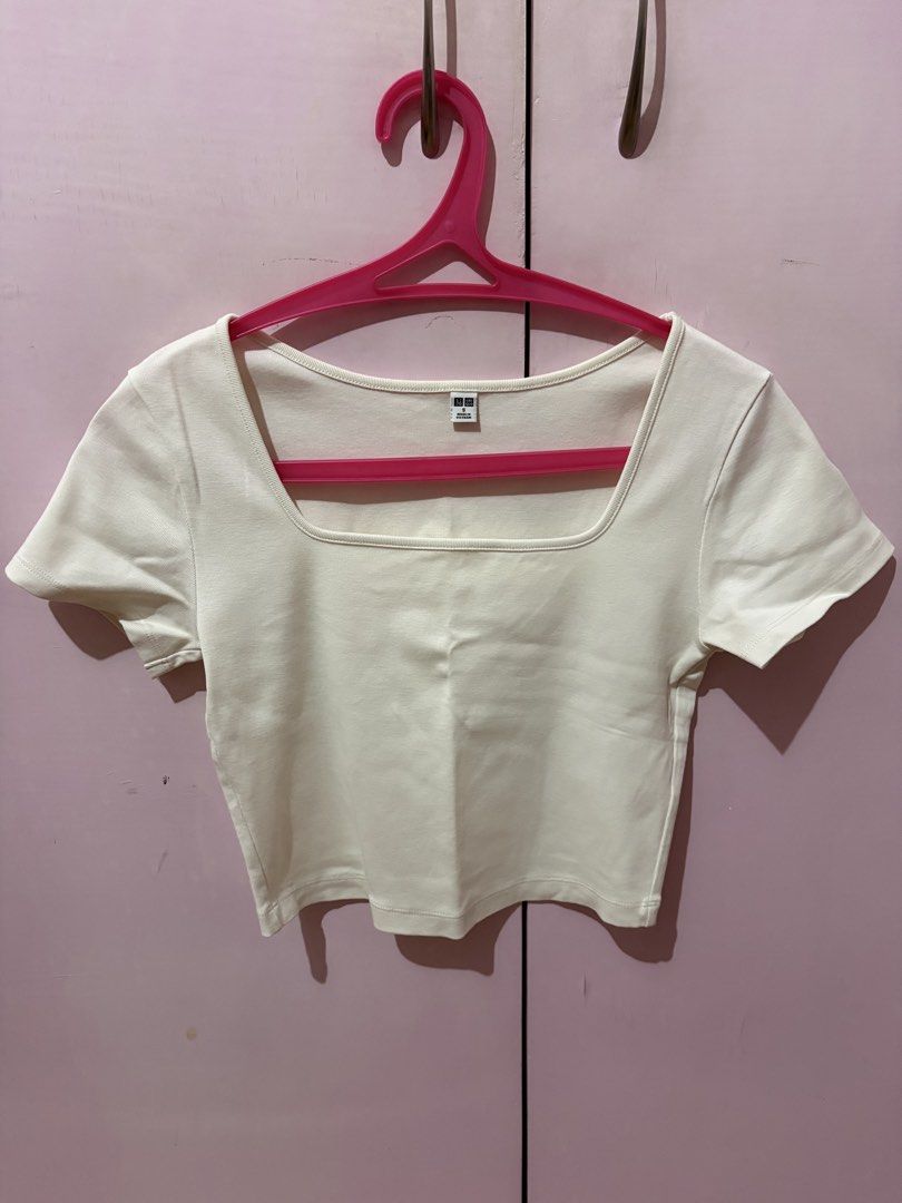 Uniqlo White Square Neck Cropped Top (Category: Shirts) located in Taguig. Submitted by xoalexv (Listing ID 1459992324, Image 1). Description: - White cropped top from Uniqlo - Features short sleeves and a square neckline - Simple and versatile design - Perfect for layering or wearing on its own - Easy to style with various bottoms.