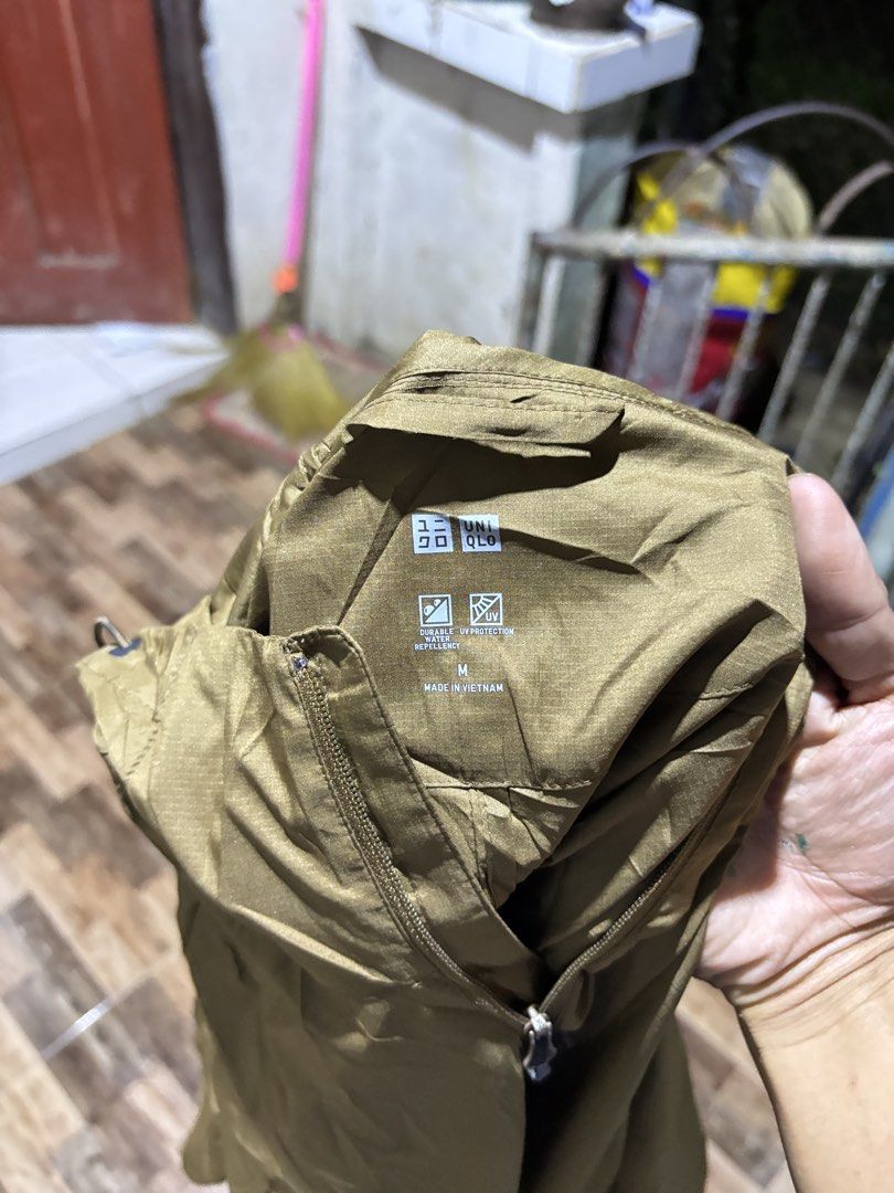 Uniqlo Windbreaker Jacket (Category: Coats, Jackets and Outerwear) located in Manila. Submitted by jaggalarrita (Listing ID 1460025669, Image 2). Description: - Uniqlo Windbreaker Jacket - Color: Olive Green - Lightweight and Packable - Features a Hood - Half-Zip Closure - Made in Vietnam - Ideal for Outdoor Activities or Casual Wear.