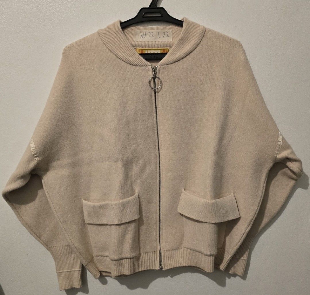 UTTI Beige Zip-Up Cardigan with Pockets (Category: Coats, Jackets and Outerwear) located in Quezon City. Submitted by ShoesManila (Listing ID 1460092346, Image 1). Description: UTTI cardigan Width 22 Length 22 Co Condition: Excellent No issue - Cozy beige zip-up cardigan - Two front pockets for convenience - Ribbed cuffs and hem for a snug fit - Stylish ring pull zipper - Subtle ribbon details on sleeves - Ideal for layering and casual wear Ready