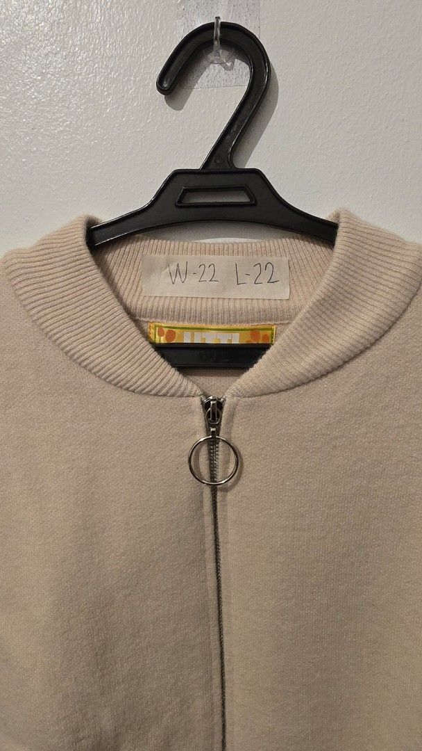 UTTI Beige Zip-Up Cardigan with Pockets (Category: Coats, Jackets and Outerwear) located in Quezon City. Submitted by ShoesManila (Listing ID 1460092346, Image 3). Description: UTTI cardigan Width 22 Length 22 Co Condition: Excellent No issue - Cozy beige zip-up cardigan - Two front pockets for convenience - Ribbed cuffs and hem for a snug fit - Stylish ring pull zipper - Subtle ribbon details on sleeves - Ideal for layering and casual wear Ready