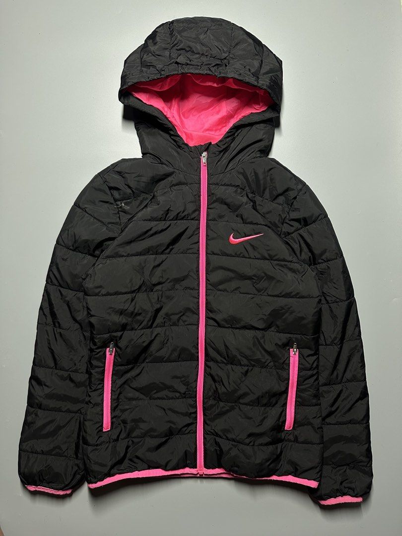 V4 - 4 Nike youth puffer jacket (Category: Hoodies) located in Bauang. Submitted by laceituplu (Listing ID 1460082687, Image 1). Description: Nike youth puffer jacket featuring a bright pink hood lining, zipper, and matching pink Swoosh logo on the chest..
