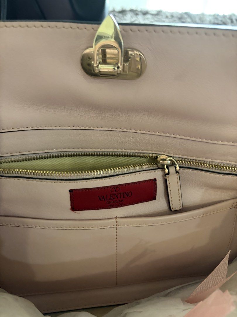 Valentino Beige Leather Medium Rockstud Trapeze Tote (Category: Luxury Bags & Wallets) located in Antipolo. Submitted by pinkktopaz (Listing ID 1459986387, Image 3). Description: Like new, minor folds/creases from storage but barely used With original dust bag and authenticity cards Slightly negotiable.