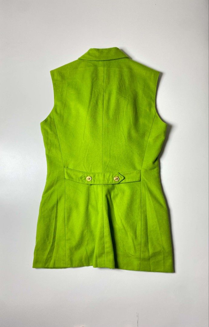 VERSACE VERSUS WOOL WAISTCOAT (Category: Others Tops) located in Balanga. Submitted by dig_gear (Listing ID 1459938235, Image 2). Description: GIANNI VERSACE VERSUS WOOL WAISTCOAT This vintage Versus Gianni Versace waistcoat is crafted from a vibrant lime green wool fabric, structured with princess seams to create a highly tailored, longline silhouette. It features a sophisticated notched collar, a classic lapel, two horizontal welt hip pockets, 