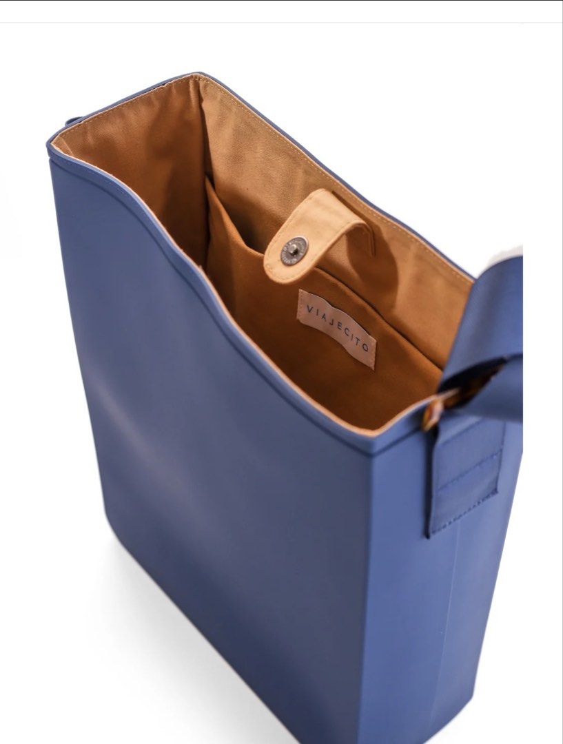 Viajecito MNL Laptop Tote (Category: Laptop Bags & Sleeves) located in Muntinlupa City. Submitted by caseypeech (Listing ID 1459923334, Image 3). Description: - Bag Dimensions: (L) 11.9” x (W) 4.52” x (H) 14.3” - Navy Blue, Nylon Straps (Adjustable for Comfort) w/ Heavy-Duty Acrylic Sliders (Sleek & Durable) - Canvas Inner Lining (Soft & Protective) - 3 Inner Pockets for Better Organization - Sleek • Durable • Work-Ready • Water-Resistant - RFS: 