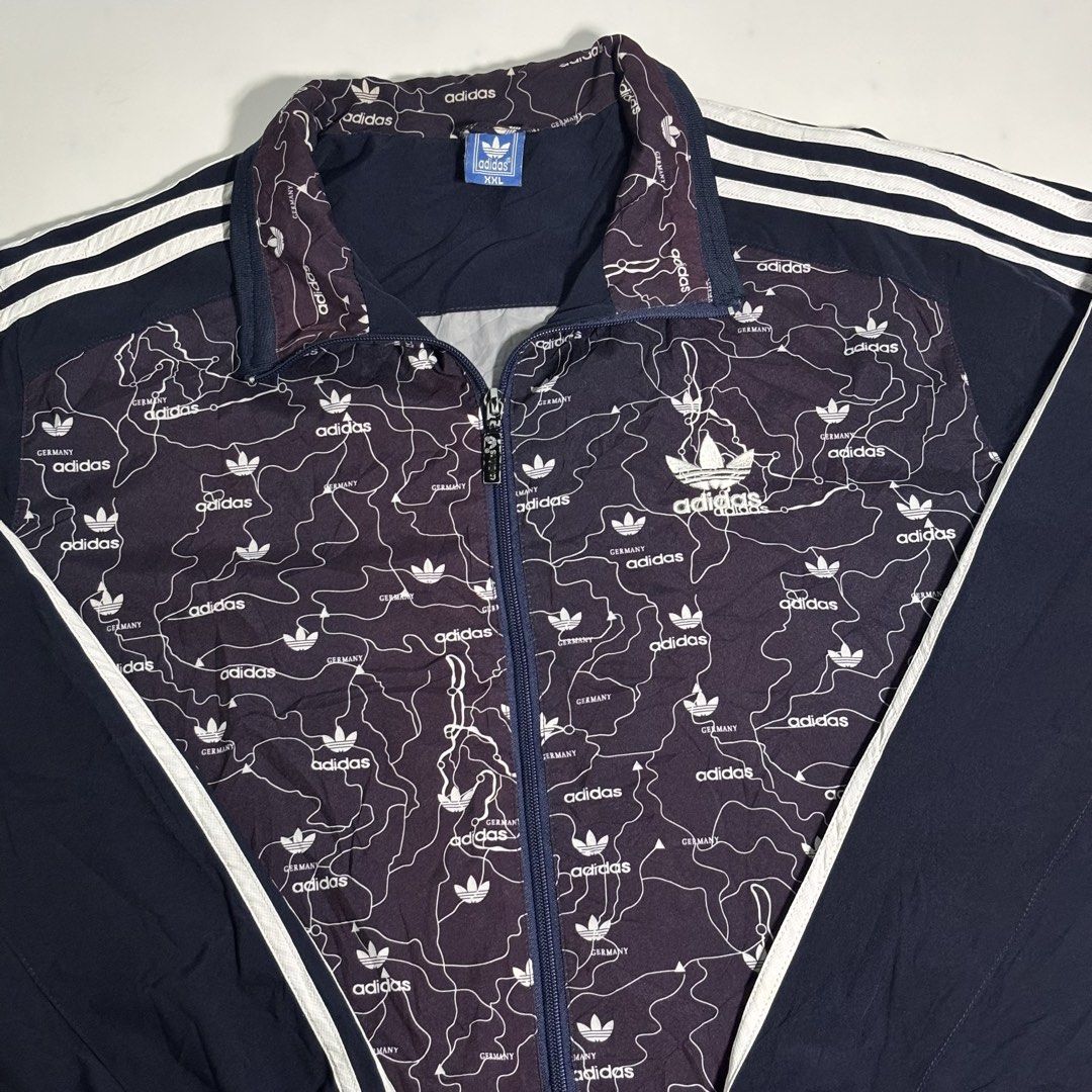 Vintage Adidas Track Jacket Germany Map Print (Category: Coats, Jackets and Outerwear) located in Cavite. Submitted by sidirvinp76902 (Listing ID 1460091991, Image 2). Description: - Unique all-over Germany map print - Classic Adidas three stripes on sleeves - Full zip closure - Ribbed cuffs and hem - Perfect for casual wear or sports.