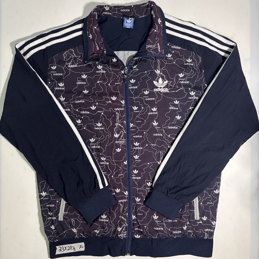 Vintage Adidas Track Jacket Germany Map Print (Category: Coats, Jackets and Outerwear) located in Cavite. Submitted by sidirvinp76902 (Listing ID 1460091991, Image 1). Description: - Unique all-over Germany map print - Classic Adidas three stripes on sleeves - Full zip closure - Ribbed cuffs and hem - Perfect for casual wear or sports.