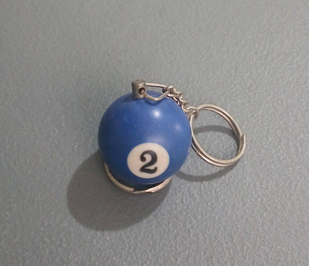 Vintage Blue Pool Ball Number 2 Keychain (Category: Character Goods) located in Bulacan. Submitted by honhonliz (Listing ID 1459918217, Image 2). Description: - Cool keychain shaped like a blue pool ball. - Features the number 2. - Comes with a durable metal ring and chain. - Ideal for personalizing your keys or bag. - A unique and stylish accessory..