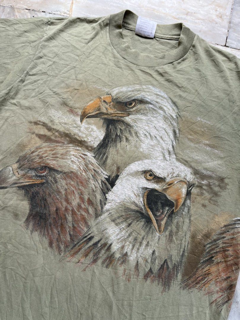 Vintage Eagle Tee (Category: Tshirts & Polo Shirts ) located in Camaligan. Submitted by thriftcouturebyaybs (Listing ID 1460066034, Image 2). Description: - Excellent Condition - Issue:see Last 2 pics - Single Stitch All over - Buyer Should Handle The Shipping Cost - W: 21 inch - L: 29 inch .
