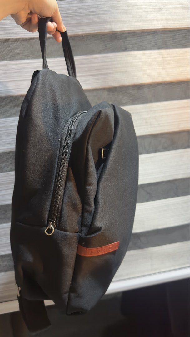 vintage prada mini asymmetrical black backpack (Category: Backpacks) located in Manila. Submitted by moncurr (Listing ID 1460027606, Image 2). Description: - vintage - no damages on bag body - clean - flaw is one zipper tag is missing but everything still works and intact - nego for sure buyers - 500 if okay for late ship out.