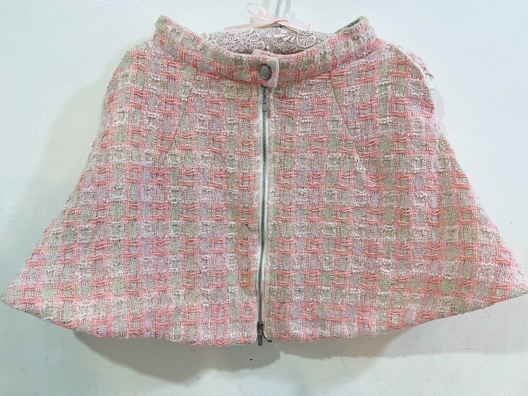 bundle Vintage Tweed coquette skirt (Category: Skirts) located in Cavite. Submitted by wishie_collects (Listing ID 1459975098, Image 2). Description: Mini and Midi length tweed skirts First Skirt (Pink Tweed Straight-Fit Skirt): This is a straight-cut, mini-length skirt made from a textured pink tweed fabric. It features a delicate multicolor woven pattern with subtle flecks of blue, yellow, and white throughout. The hemline is finished with a ch