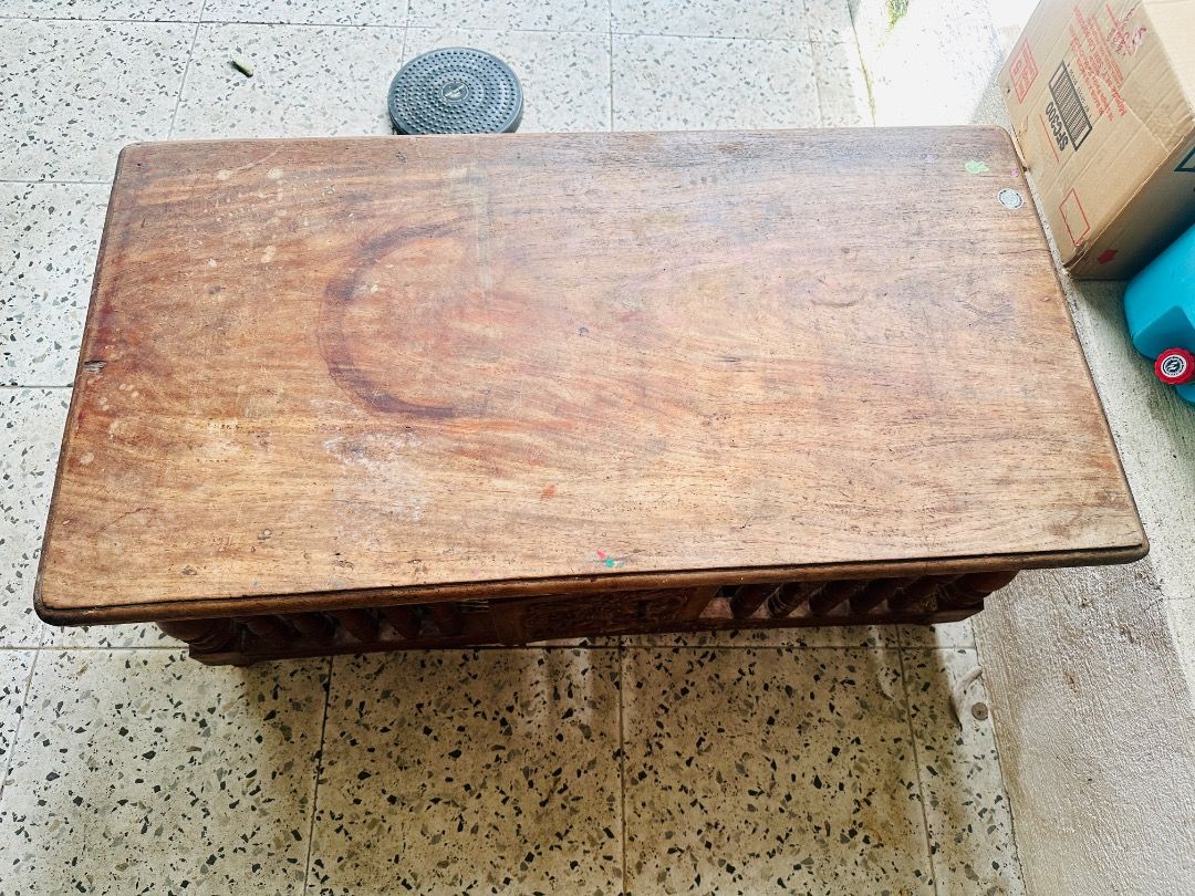 Vintage Narra Coffee Table with Carved Details (Category: Tables & Sets) located in Cavite. Submitted by badqueen003 (Listing ID 1459960086, Image 2). Description: - Vintage narra coffee table - Unique carved details on each side - has cabinet doors front and back - Perfect for rustic or antique-themed living spaces - Dimensions: Approx. 104cm (L) x 55cm (W) - Needs some varnishing - has minor to scratches. See photos for reference .