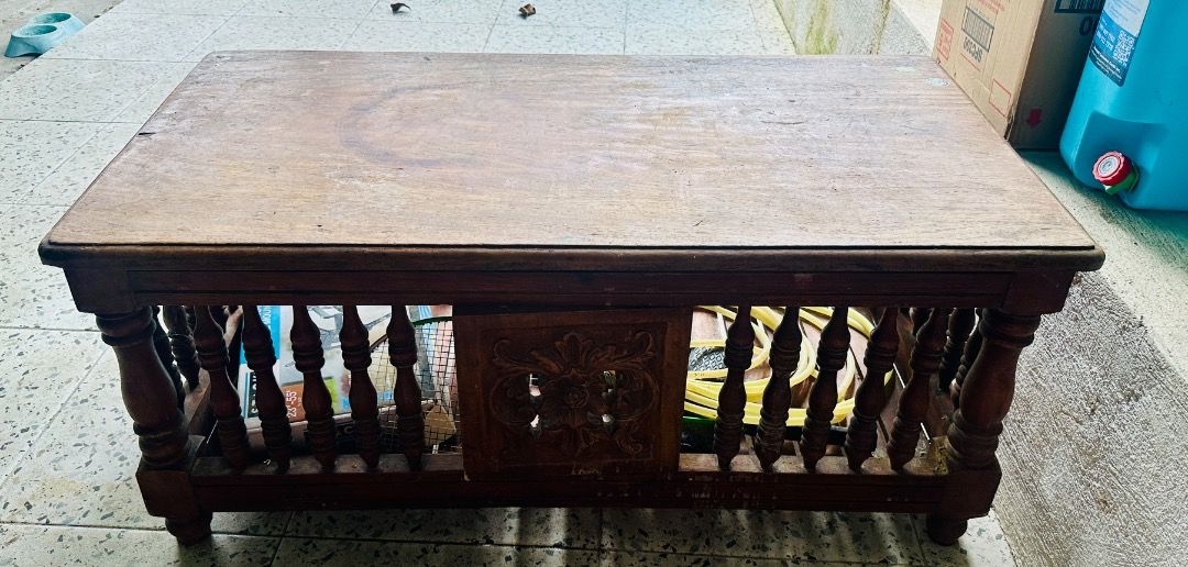 Vintage Narra Coffee Table with Carved Details (Category: Tables & Sets) located in Cavite. Submitted by badqueen003 (Listing ID 1459960086, Image 1). Description: - Vintage narra coffee table - Unique carved details on each side - has cabinet doors front and back - Perfect for rustic or antique-themed living spaces - Dimensions: Approx. 104cm (L) x 55cm (W) - Needs some varnishing - has minor to scratches. See photos for reference .