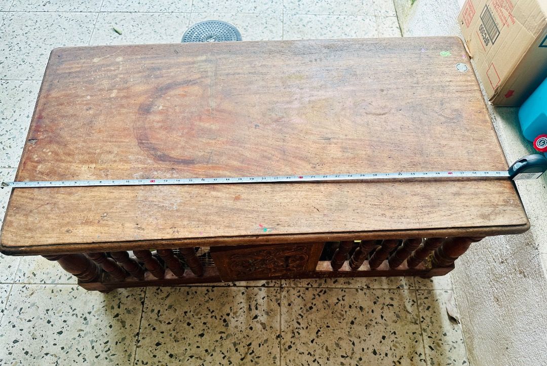Vintage Narra Coffee Table with Carved Details (Category: Tables & Sets) located in Cavite. Submitted by badqueen003 (Listing ID 1459960086, Image 3). Description: - Vintage narra coffee table - Unique carved details on each side - has cabinet doors front and back - Perfect for rustic or antique-themed living spaces - Dimensions: Approx. 104cm (L) x 55cm (W) - Needs some varnishing - has minor to scratches. See photos for reference .