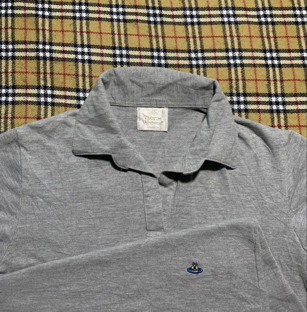 Vivienne Westwood Top (Category: Activewear) located in Claveria. Submitted by plasticcase__ (Listing ID 1459909555, Image 1). Description: - Brand: Vivienne Westwood - Color: Grey - Style: Polo Shirt - Condition: Good.