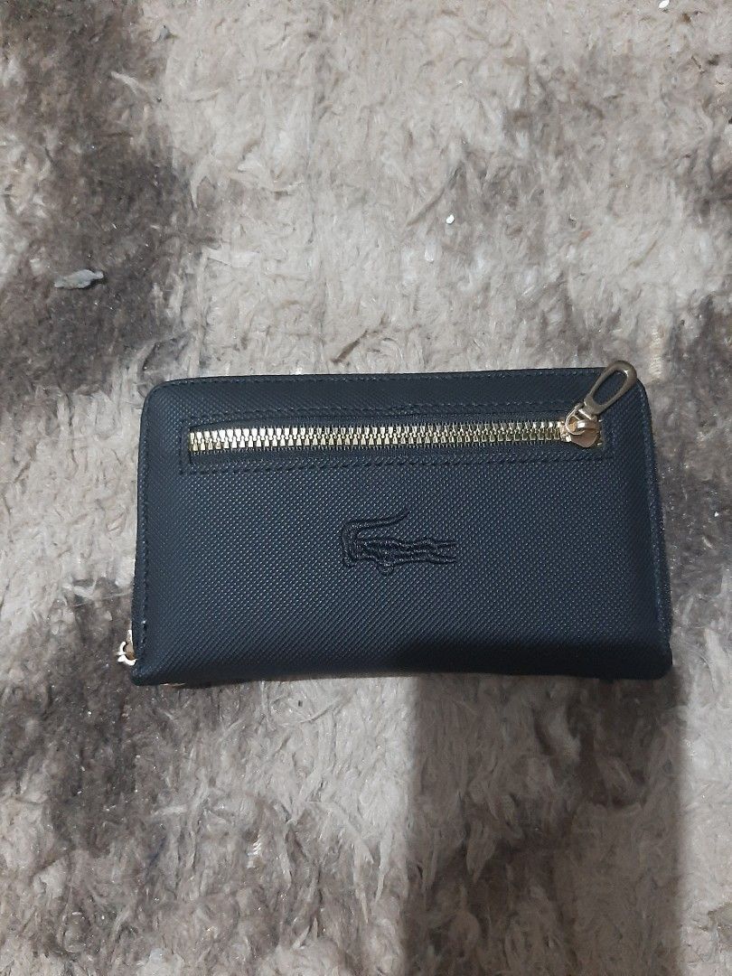 Wallet with Zipper (Wrislet) (Category: Wallets & Card holders) located in Davao. Submitted by nisa_chan04 (Listing ID 1460074423, Image 2). Description: - Stylish army green/black wallet - Secure gold zipper closure - Subtle embossed logo detail - Spacious interior for cards and cash - Ideal for everyday carry.