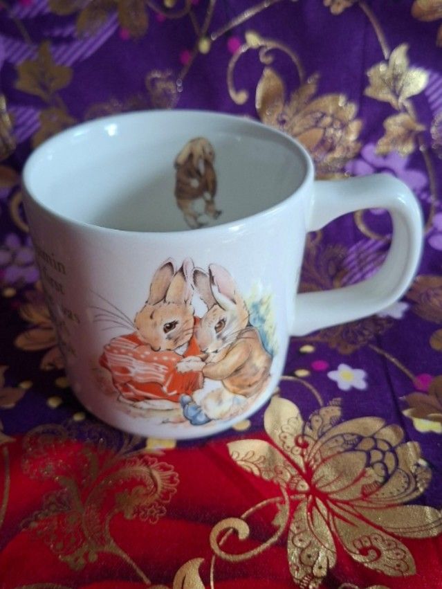 Wedgwood Peter Rabbit Mug (Category: Coffee & Tea Tableware) located in Consolacion. Submitted by luxekerei (Listing ID 1457200831, Image 1). Description: - vintage Wedgwood Beatrix Potter "Benjamin Bunny" children's mug featuring a classic illustration of Benjamin Bunny and Peter Rabbit on the front..