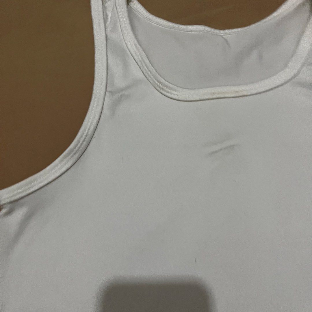 White Cropped Tank Top (Category: Sleeveless) located in Manila. Submitted by yenprelovedclothes (Listing ID 1459916363, Image 2). Description: - Basic white cropped tank top - Racerback style - Stretchy material for comfort - Minor faint marks on front (please check photos) - Versatile: perfect for layering or wearing on its own Need rewash.