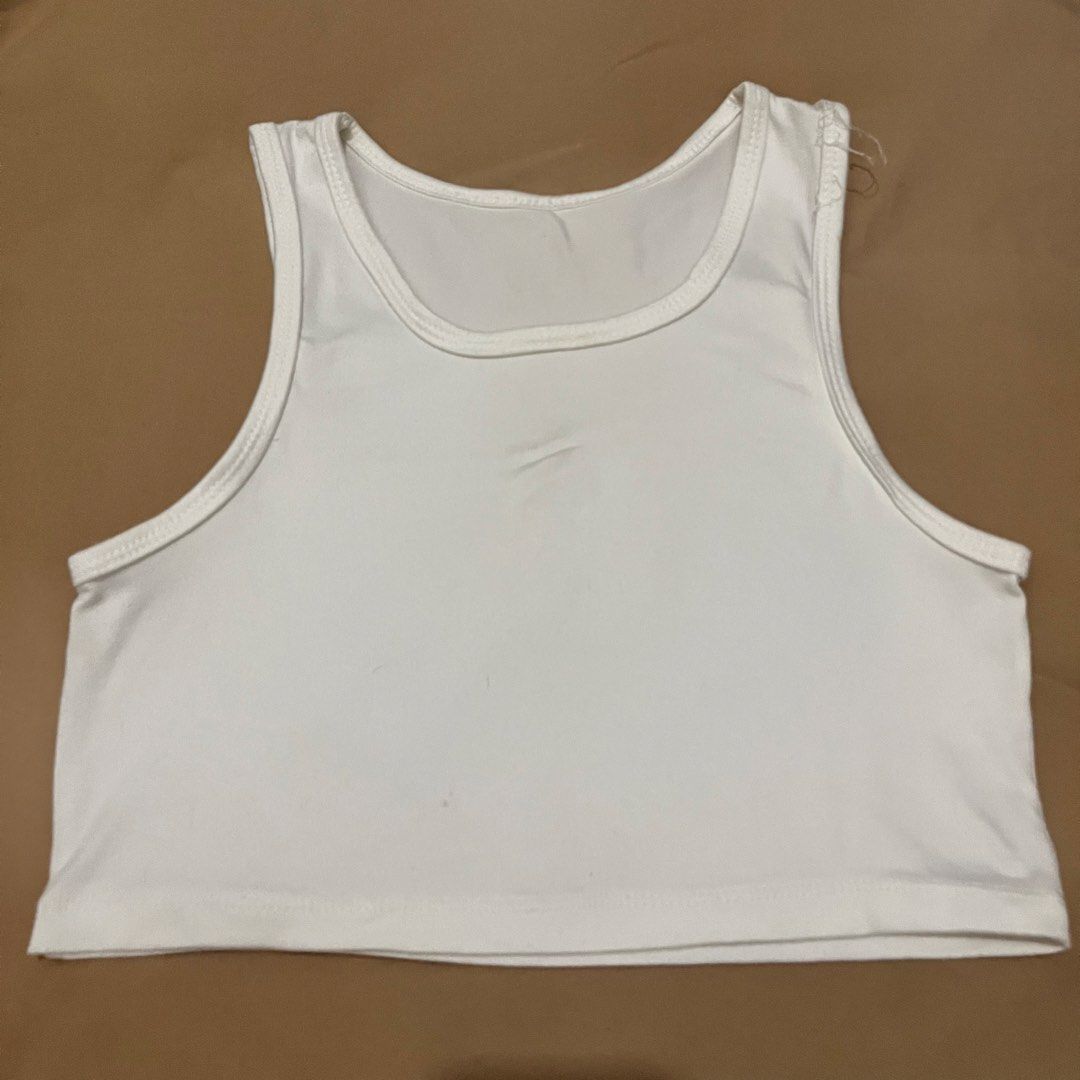White Cropped Tank Top (Category: Sleeveless) located in Manila. Submitted by yenprelovedclothes (Listing ID 1459916363, Image 1). Description: - Basic white cropped tank top - Racerback style - Stretchy material for comfort - Minor faint marks on front (please check photos) - Versatile: perfect for layering or wearing on its own Need rewash.
