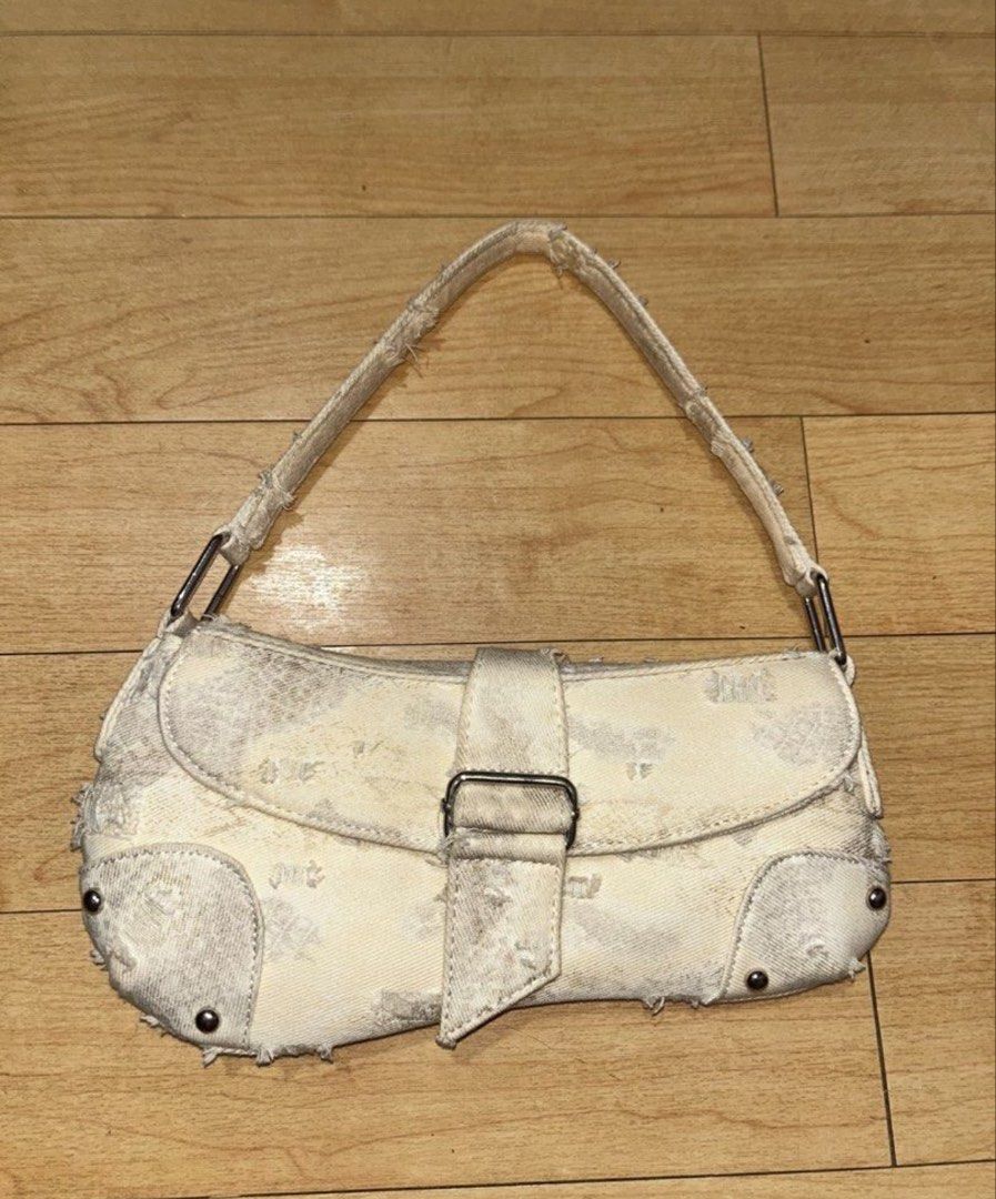 White Denim Shoulder Bag with Distressed Details (Category: Shoulder Bags) located in Mandaluyong City. Submitted by bayline999 (Listing ID 1459921449, Image 1). Description: - White denim shoulder bag - Cool distressed look all over - Buckle closure on front flap - Single strap - Perfect for casual wear - Shows some signs of wear (edges and strap).