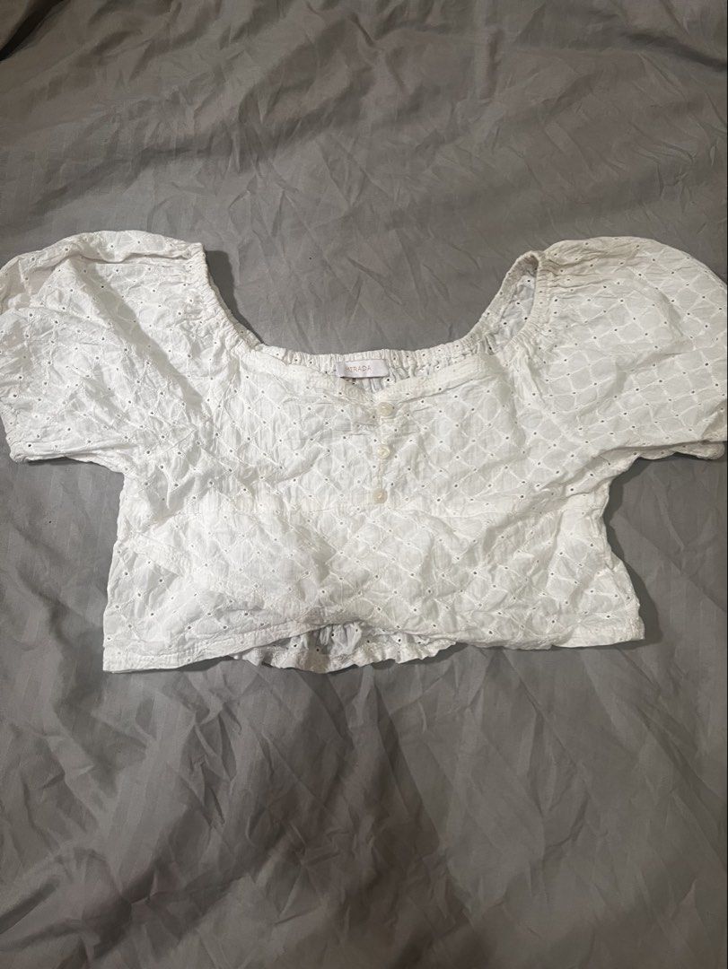 White Eyelet puff sleeves Cropped top (S) (Category: Blouses) located in Paranaque City. Submitted by michcianox (Listing ID 1460015411, Image 1). Description: Eyelet designed white cropped top with garter on the back area and button details on the chest S Brand: Mirada Price does not include shipping fee Can ship through lalamove 📍meet up location: SM Sucat 💵 payment through gcash/maya.