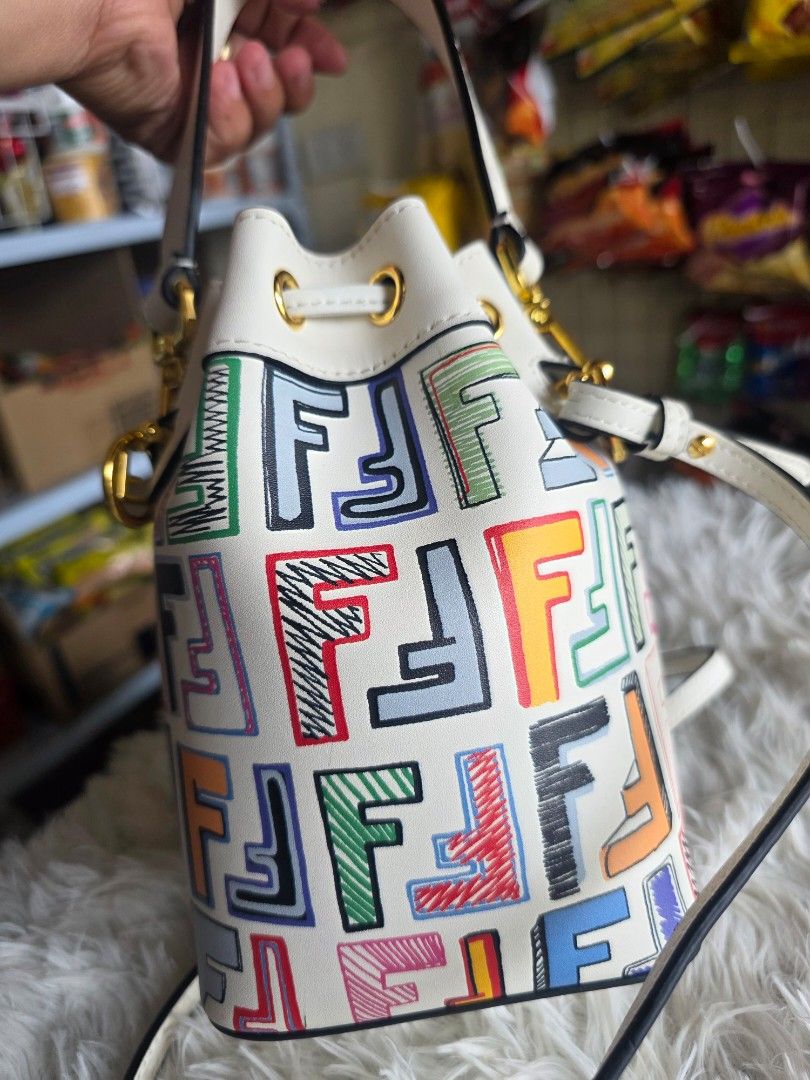 White FF Vertigo Bucket Bag (Category: Shoulder Bags) located in Lemery. Submitted by venus23 (Listing ID 1460022644, Image 3). Description: - White bucket bag - Features the unique FF Vertigo pattern - Elegant gold hardware details - Secure drawstring closure - Versatile with both a top handle and a long strap - Ideal for everyday use or evening events - Standout, unique design.