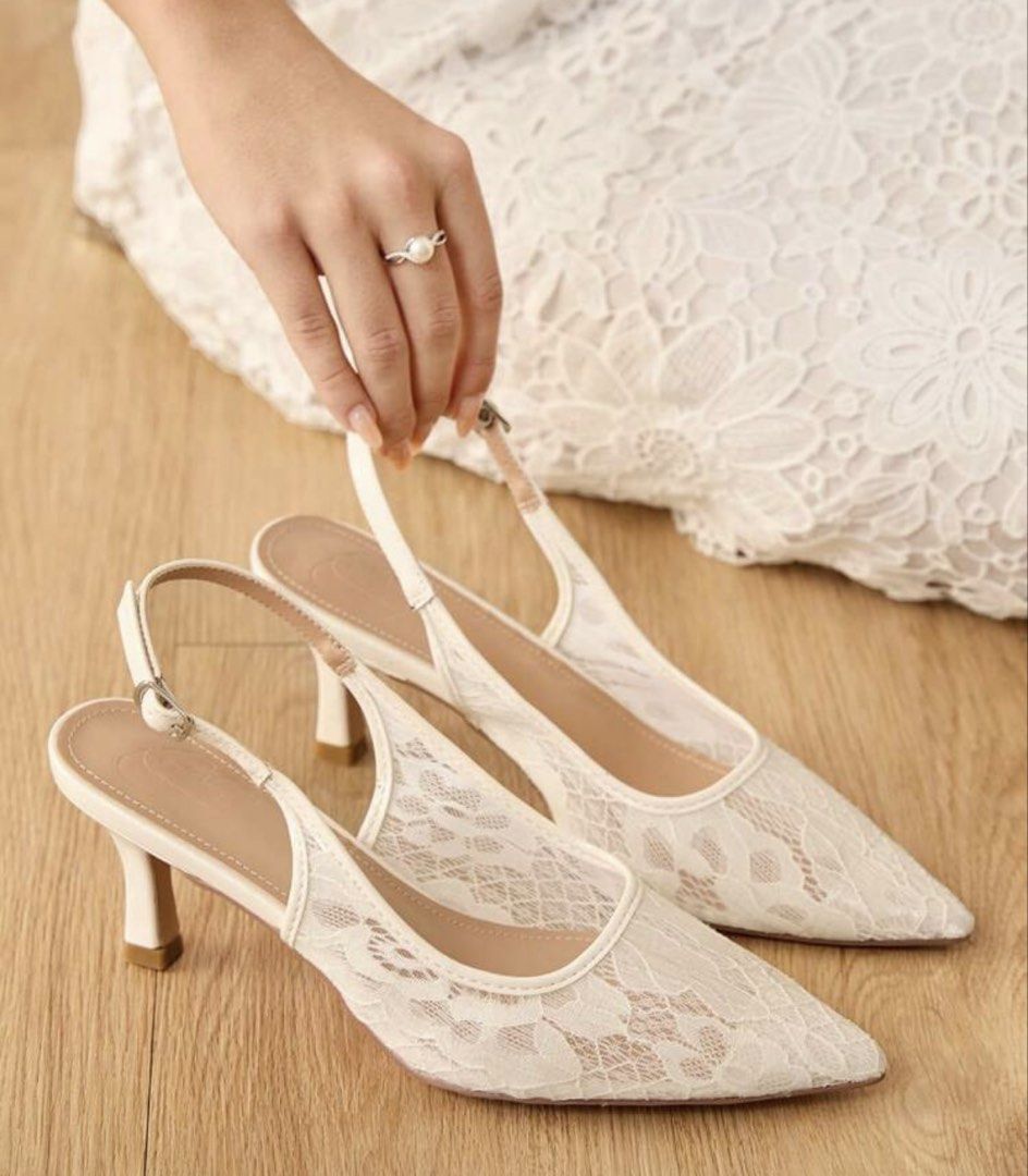 White Lace Slingback Heels with Buckle Strap (Category: Heels) located in Manila. Submitted by helpm3declutt3rrr (Listing ID 1460001908, Image 2). Description: - White lace slingback heels - Pointed toe design - Delicate lace overlay - Adjustable buckle strap at the heel - Low kitten heel - Ideal for weddings and special occasions.