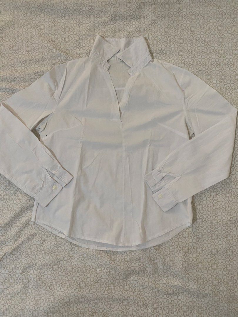 White Long Sleeve Collared Shirt (Category: Longsleeves) located in Quezon City. Submitted by irldn_ (Listing ID 1459981827, Image 3). Description: - Classic white long sleeve shirt - Features a pointed collar and V-neckline - Button cuffs on sleeves - Simple and versatile design - Perfect for layering or wearing solo - Easily pairs with various outfits.