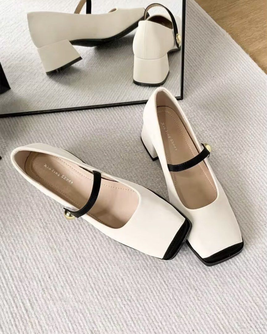 White Mary Jane Heels with Black Toe Cap and Strap (Category: Heels) located in Manila. Submitted by yunabiiiii (Listing ID 1459945157, Image 3). Description: - Cute white Mary Jane heels - Black strap with gold button detail - Square toe with black cap - Comfortable block heel Rfs: Too big for me / Wrong Size Bought in Saudi, No Box .