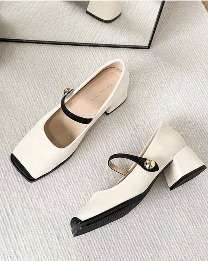 White Mary Jane Heels with Black Toe Cap and Strap (Category: Heels) located in Manila. Submitted by yunabiiiii (Listing ID 1459945157, Image 1). Description: - Cute white Mary Jane heels - Black strap with gold button detail - Square toe with black cap - Comfortable block heel Rfs: Too big for me / Wrong Size Bought in Saudi, No Box .